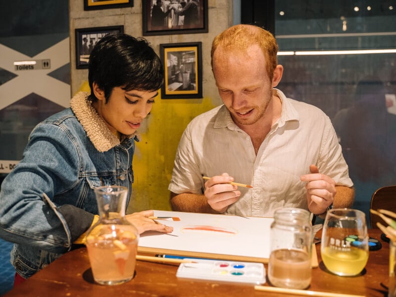 couple at christmas paint and sip class